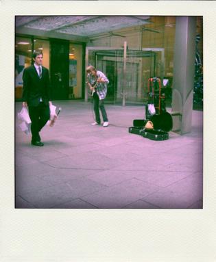Alice Walker; Queen Street; Taken as a busker played a jam on his guitar.